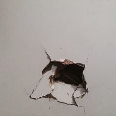 a hole in the wall that has been torn open