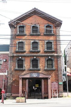 an old brick building with lots of windows