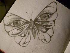 a pencil drawing of a butterfly with eyes