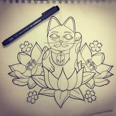 a drawing of a cat sitting on top of flowers with a pen next to it