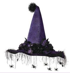 a purple witches hat with black spider legs