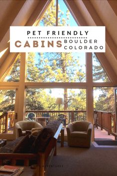 a living room filled with furniture and a large window that reads pet friendly cabin's boulder colorado