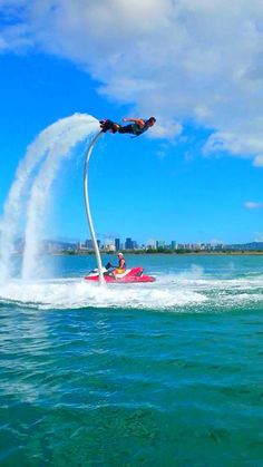 a person on a jet ski being pulled by a boat