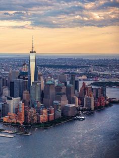 an aerial view of new york city at sunset