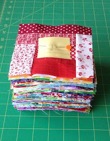 a pile of fabric sitting on top of a green cutting board next to a ruler