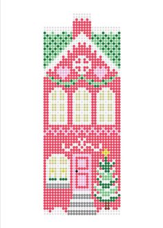 a cross stitch house with a christmas tree on the front and two windows in the back