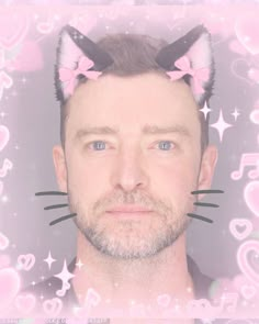 a man with cat ears on top of his head and pink hearts in the background