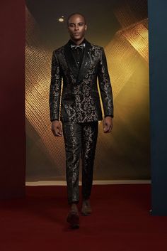 This luxury bronze tuxedo for men or women is perfect for exclusive formal events. A detailed addition to elevate your tuxedo collection. FREE SHIPPING ON ORDERS OVER $199 COLOR Black/Gold COMPOSITION N/A YARN COUNT N/A WEIGHT 290g FABRIC STYLE Jacquard OCCASION Wedding/Gala Tailored Party Wear Blazer For Semi-formal Occasions, Designer Evening Suits For Festive Occasions, Designer Festive Evening Suits, Tailored Evening Party Wear Suits, Luxury Fitted Formal Sets, Elegant Tuxedo For Black-tie Festive Events, Elegant Tuxedo For Festive Party, Luxury Fitted Suit For Festive Season, Festive Tailored Blazer For Evening