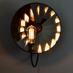 an old fashioned light fixture with several bulbs on it's side and the words, happy camper written in chinese