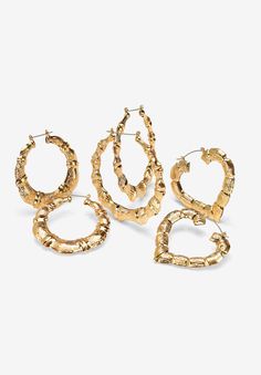 Haute hoops - Featuring this three-pair set of bamboo-style hoop earrings. Each pair is just a little different. A large round pair, a smaller round pair and a heart-shaped pair. With these three choices, you'll be prepared for any occasion. 2 1/3, 2 1/2 and 2 7/8" diametersYellow gold toneEarrings Dimensions: 76 mm wide x 75 mm long x 7 mm highEarrings Dimensions: 64 mm wide x 58 mm long x 6 mm highEarrings Dimensions: 60 mm wide x 62 mm long x 5.5 mm highIncludes gift box and drawstring pouchI Mexican Jewelry Gold, 90s Jewelry Trends, Jewelry Gold Earrings, 60s Jewelry, Hoop Earring Set, Turquoise Jewelry Earrings, Beaded Jewelry Earrings, Bamboo Hoop Earrings, Bamboo Earrings