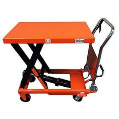 an orange scissor table on wheels with the back turned to look like it's lifting