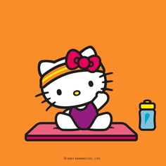 a hello kitty sitting on top of a pink mat next to a bottle and cup