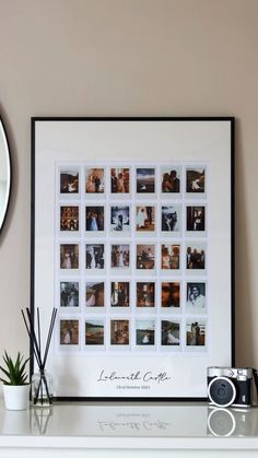 a white mantle topped with a framed photo and a camera next to a clock on top of a wall