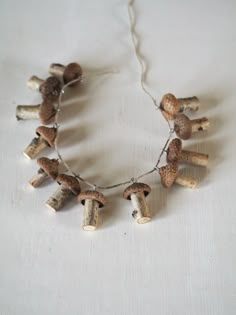 a necklace made out of wine corks and mushrooms