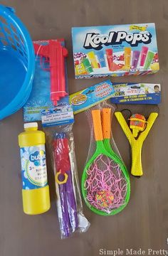 the contents of a play doh bag laid out on top of a wooden table