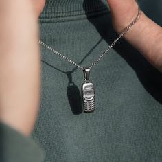 CUSTOM MADE PHONE IN SILVER PLATED STAINLESS STEEL Water/sweat/heat resistant (no green skin) Time set to 18:00 to remind you when we're dropping fresh vintage Includes: 50cm long micro cuban chain + 20mm x 5mm pendant We make our chains + pendants following our sustainable ethos. Up to 60% of the stainless steel we use has been recycled from other sources, and it can be fully recycled again to make new products in the future. Necklaces Pendant, Necklace For Men, Mens Necklace, Streetwear Jewelry, Dope Jewelry, Classy Jewelry, Vintage Clothing Online, Funky Jewelry, Jewelry Lookbook