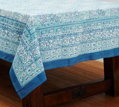 a table with a blue and white cloth on it