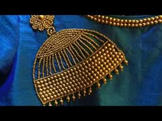 Jhumka design using beads Embroidery - YouTube Aari Work Nath Design On Blouse, Simple Wedding Blouse Designs, Jhumka Design, Embroidery Simple, Work Blouse Designs, Mirror Work Blouse Design, Gold Jhumka, Jhumka Designs, Hand Embroidery Dress