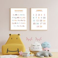 two children's wall posters with numbers and animals on them in the corner of a child's room