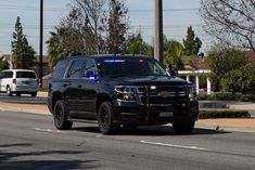 a police car is driving down the street