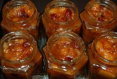 several jars filled with food sitting on top of a table