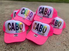 Cabo Beaches Trucker Hat Neon Pink Snap Back Playful Pink Mini Hat For Summer, Pink Fun Sun Hat For Beach Season, Playful Summer Party Hat, Pink Trucker Hat For Summer Beach, Playful Pink Sun Hat For Beach Season, Pink Summer Trucker Hat For Beach, Pink Cap Mini Hat For Summer, Pink Sun Hat For Beach Festival, Pink Summer Party Hat