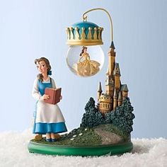 a figurine is holding a book in front of a light bulb and castle