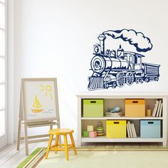 a child's room with a train decal on the wall