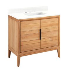 a wooden cabinet with a white counter top and two drawers on one side, and a sink on the other