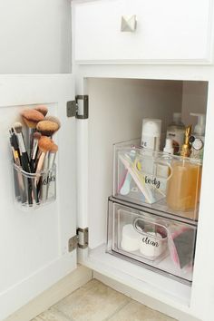 an organized bathroom cabinet with makeup and toiletries