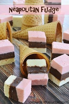 several pieces of ice cream and chocolate fudge on a wooden table