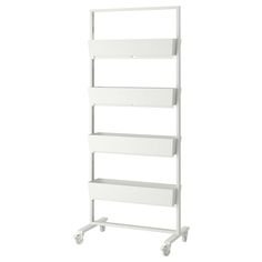 a white shelf with four drawers on wheels