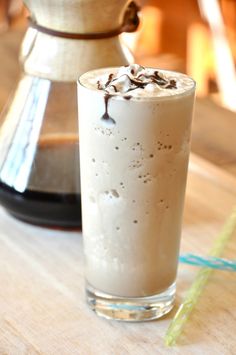 a drink sitting on top of a wooden table