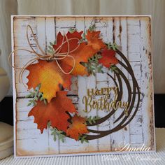 a happy birthday card with fall leaves on it