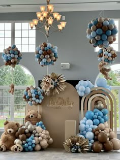 balloons and teddy bears decorate the entrance to a baby's first birthday party at home