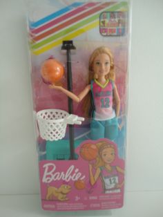 the barbie doll is holding a basketball hoop