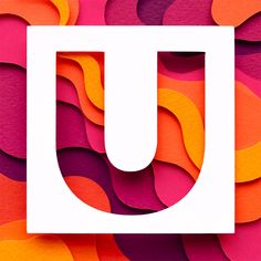 the letter u is made up of different colored paper shapes and colors that appear to be overlapping