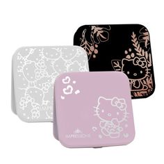 three hello kitty coasters sitting next to each other