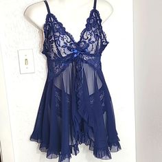 Thisose Babydoll Lacey Sheer Nightgown Set Navy Blue Size Medium Lacey Top Sheer Bottom With Ruffles The Center Opens To Show The Sexy, Lacey, Cheeky Butt Panties The Back Snaps With A Cut-Out Underneath Adjustable Straps No Underneath Approximate Measurements Pit To Pit: 16 Inches Laying Flat Length: 25 Inches From Top Of Lace Sheer Lace Sleepwear For Sleepover, Blue Sheer Sleep Dresses, Sheer Blue Sleep Dresses, Sheer Lace Sleepwear For Bedtime, Sheer Blue Nightgown For Bedtime, Sheer Lace Sleepwear, Blue Sheer Lace Sleepwear, Sheer Blue Nightgown, Coquette Blue Summer Sleepwear