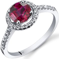 Raspberry kisses For the romantic in all of us. Our raspberry kissed rubies will leave you feeling adored. This classic ring features a round shape Peora created Ruby gemstone in 14K white gold. Responsibly sourced in every sense, our created Ruby gemstones are physically, chemically, and optically identical to their natural counterparts. We're big fans of eco-luxury. Handcrafted in pure 14K white gold goodness, this ring has been carefully coated in an elegant rhodium finish. Our artisans are expertly trained in this process which fortifies the ring's strength, shine and brilliance. Looking for an anniversary or engagement present? Our concierge stylists are here to help with all of your jewelry questions. Each purchase comes beautifully packed in one of our signature gift boxes, because Jewelry Questions, Ringe Gold, Garnet Jewelry, Ruby Jewelry, Garnet Rings, Garnet Gemstone, Classic Ring, Halo Ring, Halo Rings