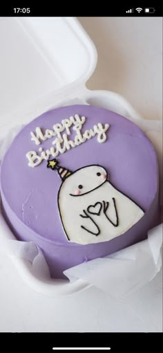 a birthday cake in a white box with purple frosting and a happy birthday message on it