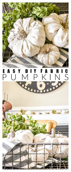 pumpkins are sitting in a metal basket on top of a table with green leaves