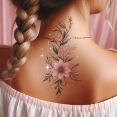 a woman's back neck with flowers painted on the upper part of her body