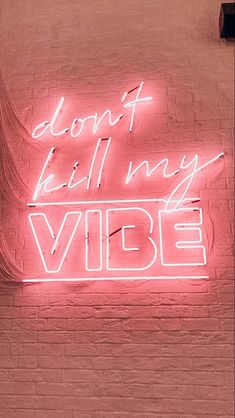 a neon sign that says don't kill my vibe