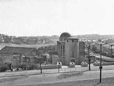 an old black and white photo of a city