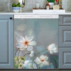 a kitchen scene with focus on the white flowers