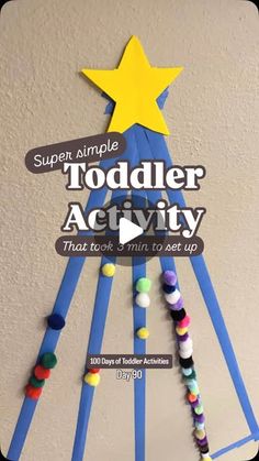 a christmas tree made out of pops sticks with the words super simple toddler activity that took him to set up