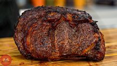 a piece of meat sitting on top of a wooden cutting board