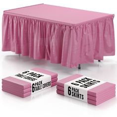 pink tablecloths with black and white labels on them, sitting next to each other