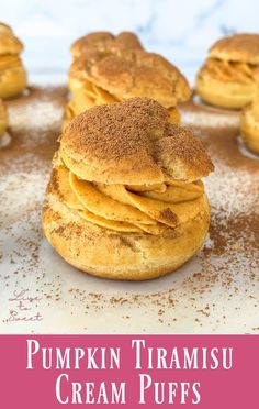 pumpkin trirami cream puffs are stacked on top of each other